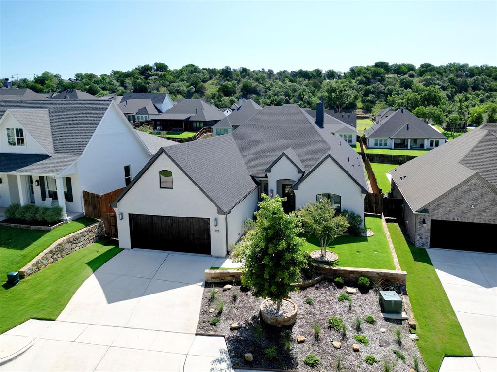 a aerial view of a house with a yard