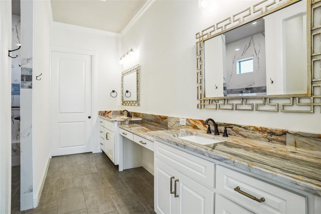 1208 Vly Rdg Drive Weatherford, TX 76087 - Photo 20 of 32 a bathroom with a granite countertop sink and a mirror