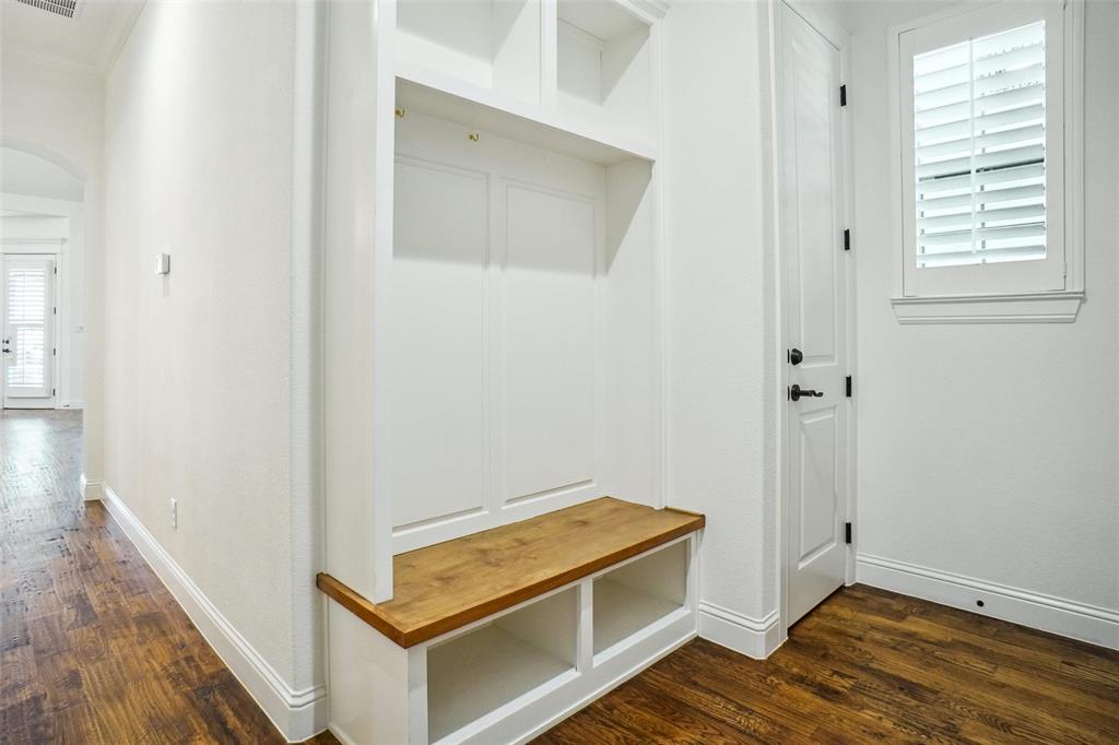 1208 Vly Rdg Drive Weatherford, TX 76087 - Photo 29 of 32 a room with wooden floor and a ceiling fan