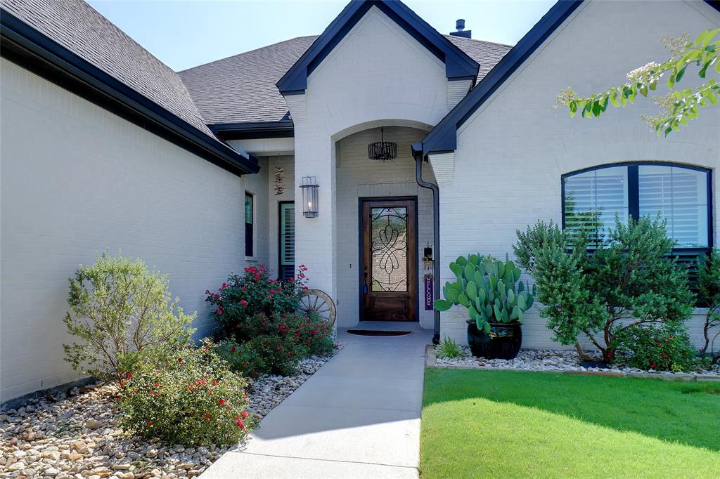 1208 Vly Rdg Drive Weatherford, TX 76087 - Photo 6 of 32 a front view of a house with garden