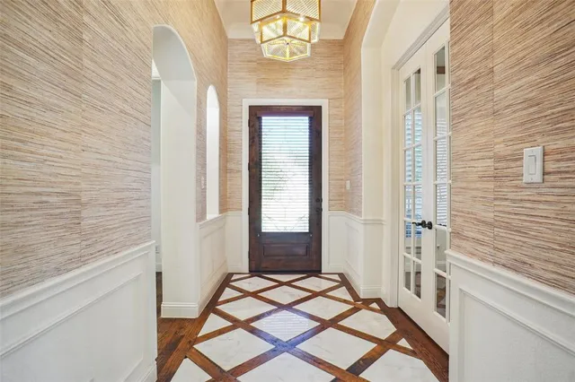 a view of empty room with wooden floor and fireplace