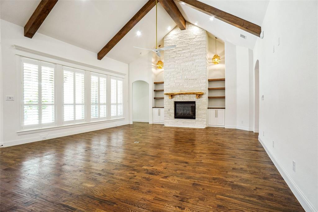 1208 Vly Rdg Drive Weatherford, TX 76087 - Photo 9 of 32 a view of empty room with wooden floor and fireplace