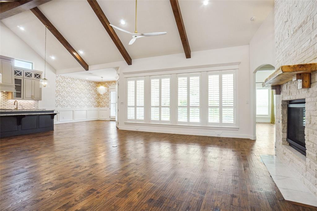 1208 Vly Rdg Drive Weatherford, TX 76087 - Photo 10 of 32 a view of an empty room with wooden floor and a window