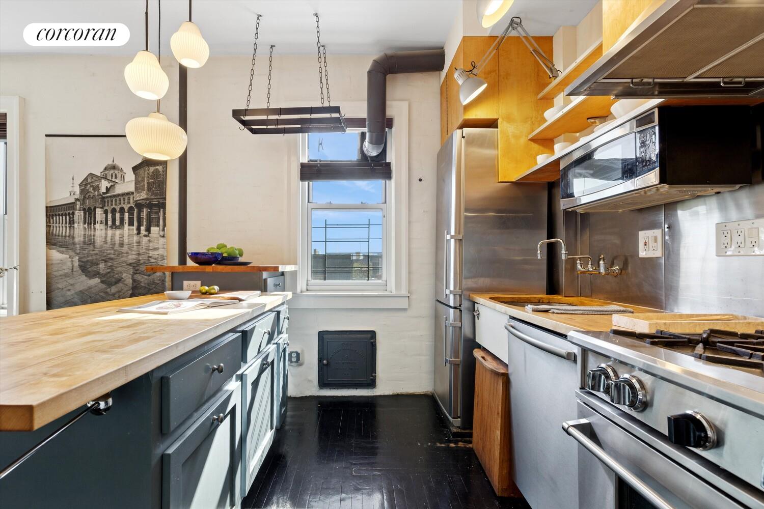930 St Nicholas Avenue, Unit 53 Manhattan, NY 10032 - Photo 3 of 12 a kitchen with a stove and a sink