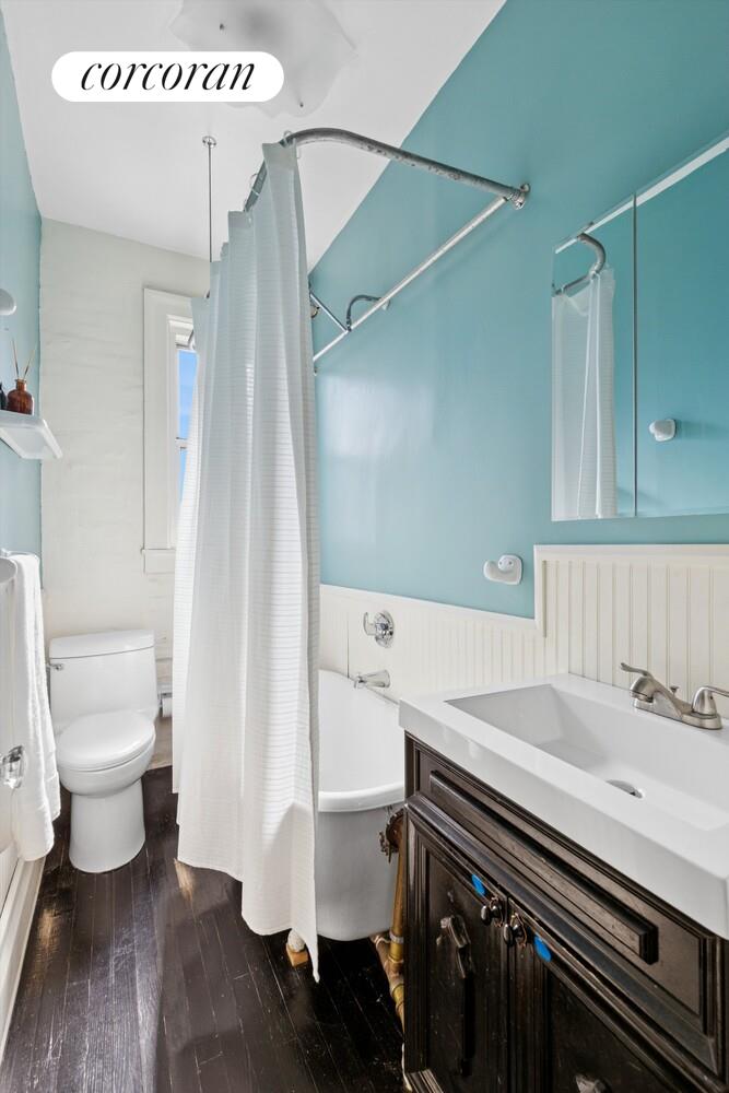 930 St Nicholas Avenue, Unit 53 Manhattan, NY 10032 - Photo 6 of 12 a bathroom with a sink a toilet and a mirror