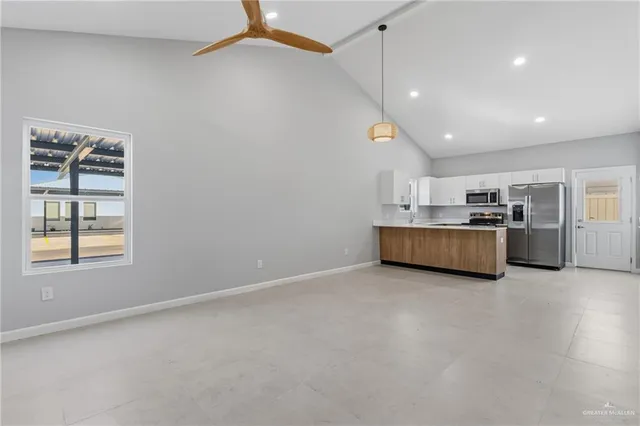 a view of a kitchen with a sink and cabinet
