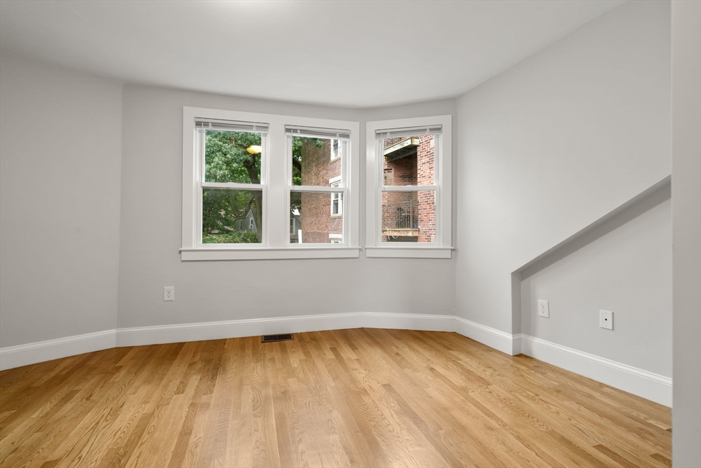 129 Sutherland Road, Unit A Boston, MA 02135 - Photo 24 of 38 an empty room with a window