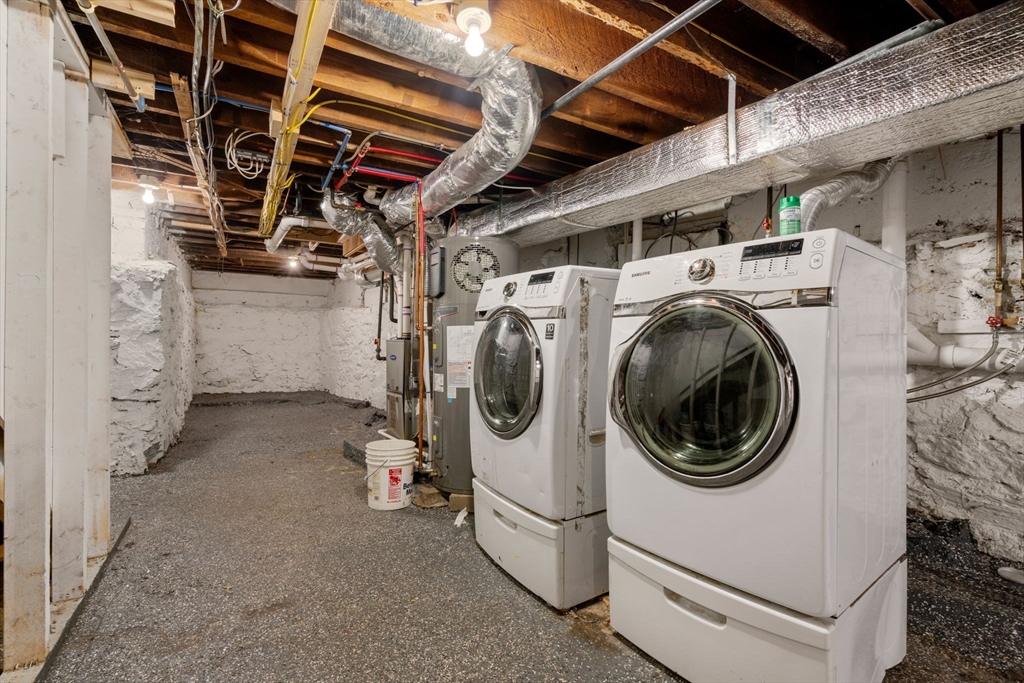 129 Sutherland Road, Unit A Boston, MA 02135 - Photo 34 of 38 a utility room with dryer washer and stair