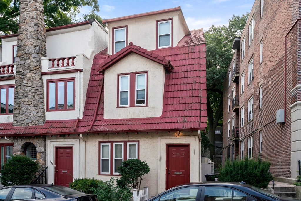 129 Sutherland Road, Unit A Boston, MA 02135 - Photo 37 of 38 a front view of a house with yard