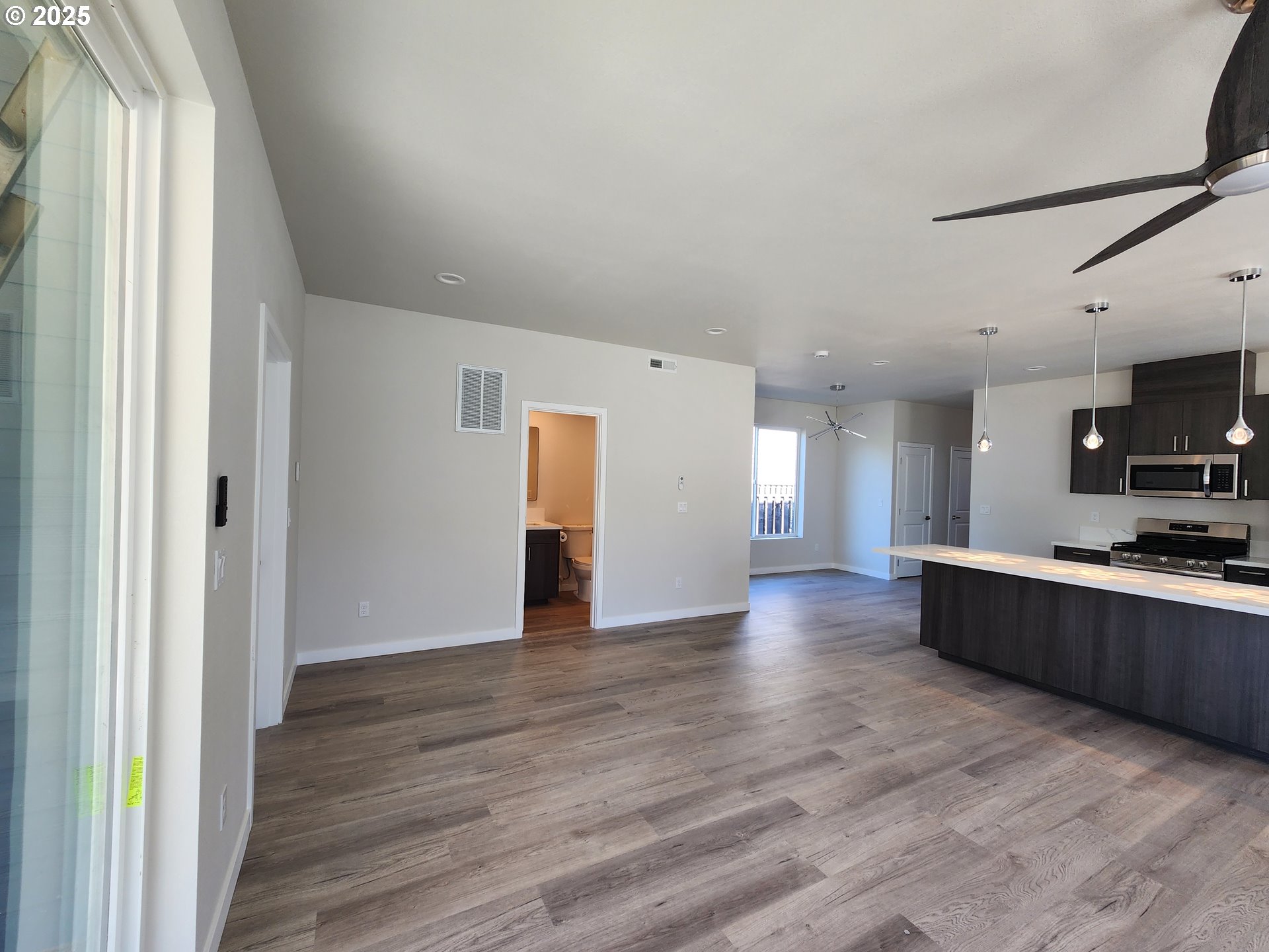 28683 Southwest Canyon Creek Road Wilsonville, OR 97070 - Photo 13 of 29 a view of a kitchen with wooden floor and a sink