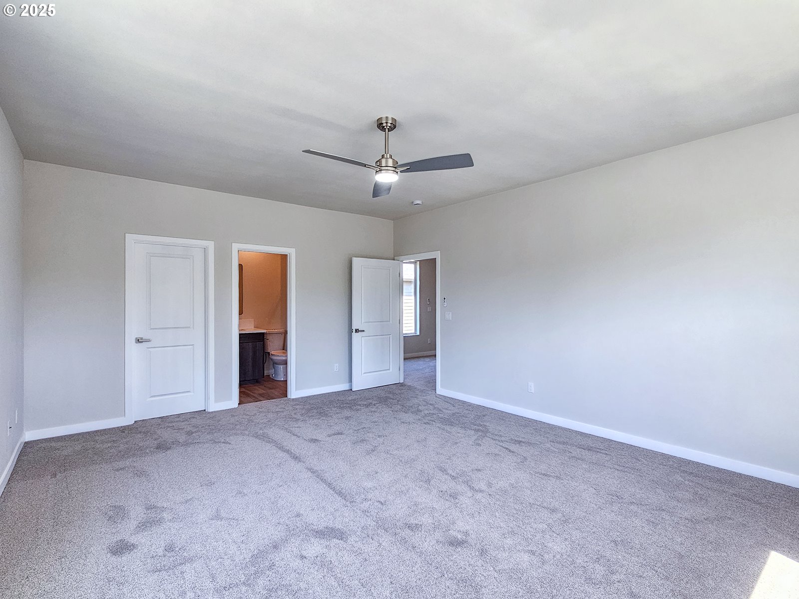 28683 Southwest Canyon Creek Road Wilsonville, OR 97070 - Photo 15 of 29 an empty room with closet and windows