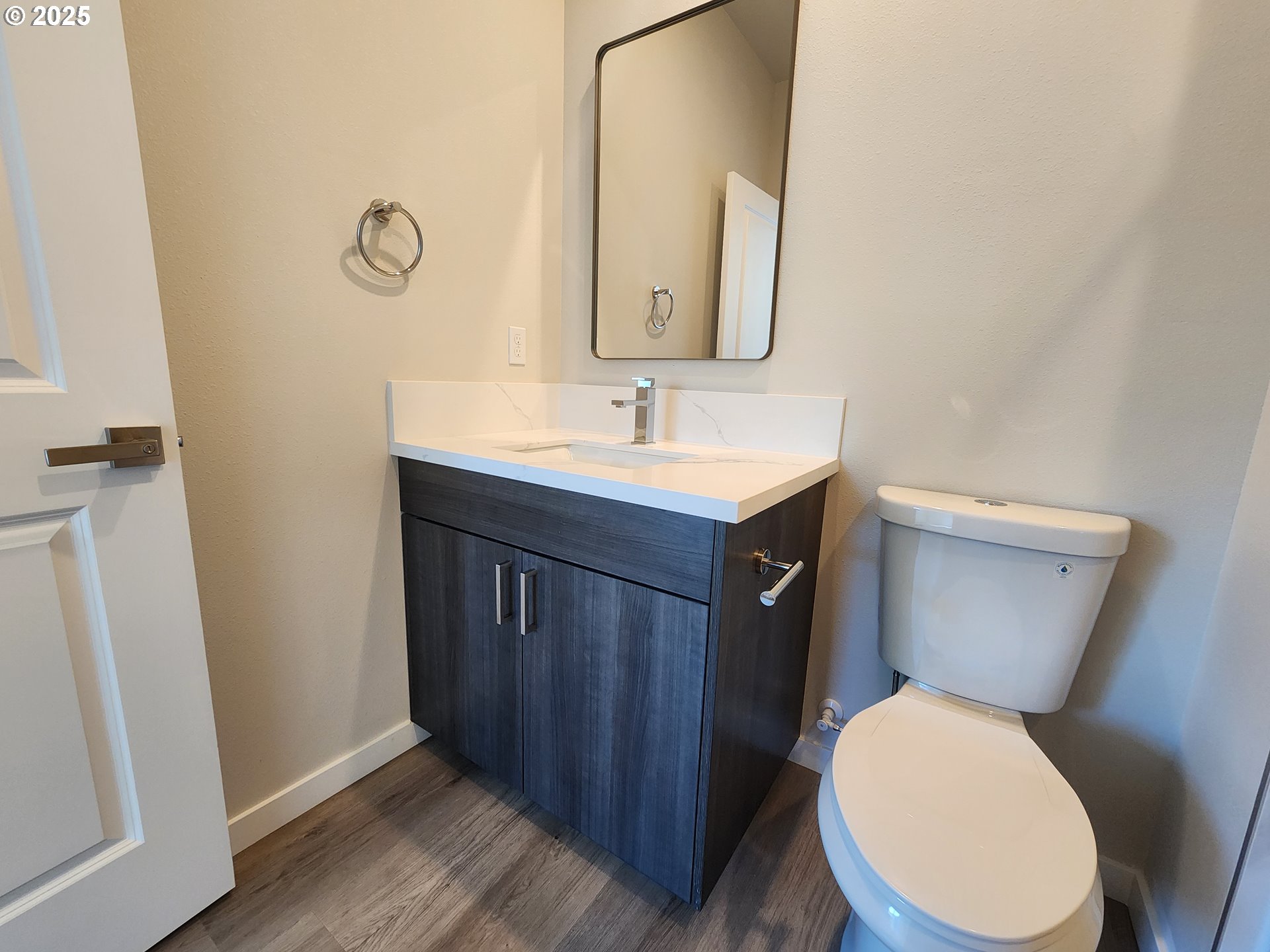 28683 Southwest Canyon Creek Road Wilsonville, OR 97070 - Photo 7 of 29 a bathroom with a toilet a sink and mirror