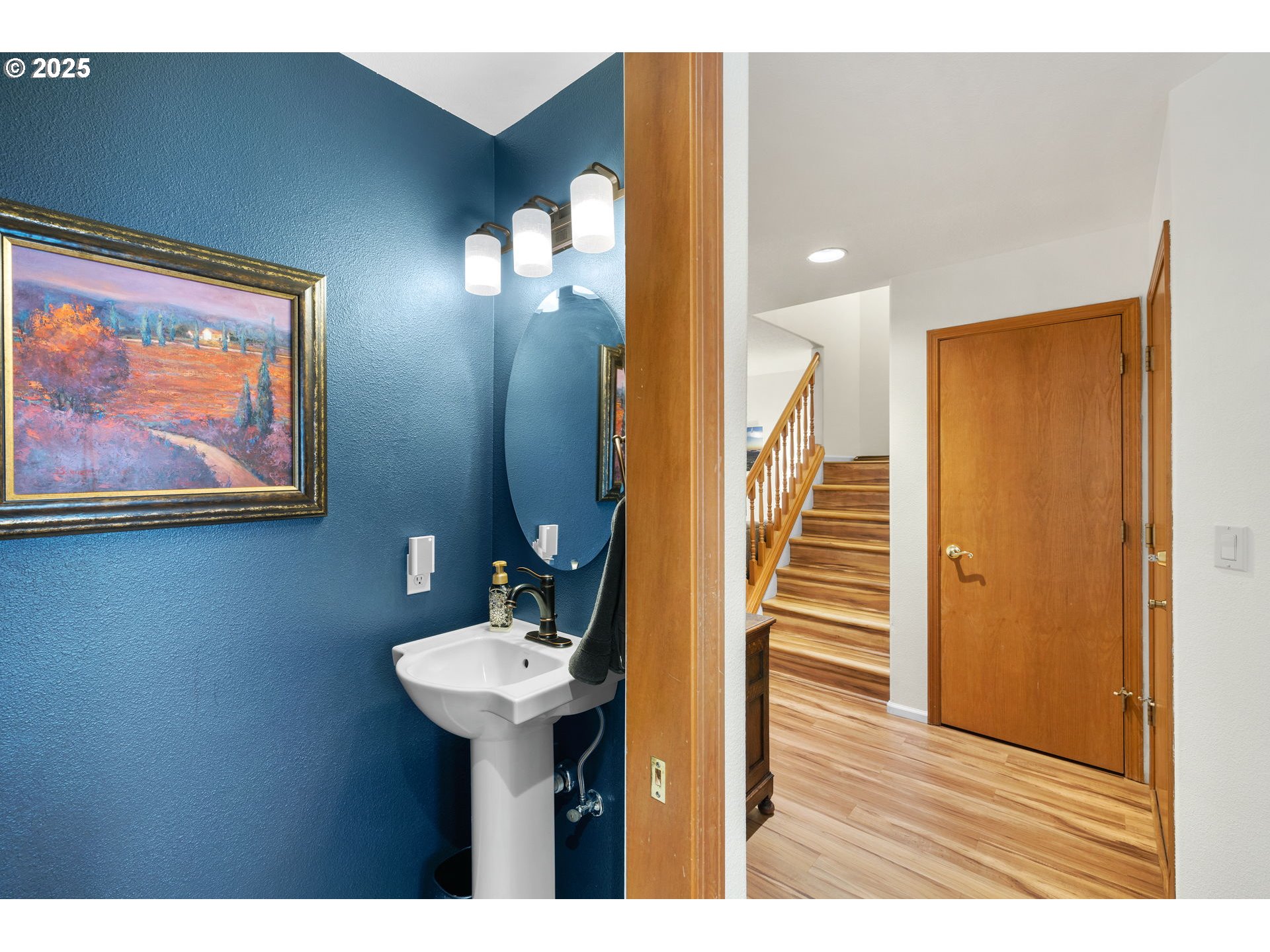 1021 Southwest 24th Street Troutdale, OR 97060 - Photo 13 of 34 a view of a hallway with wooden floor and staircase