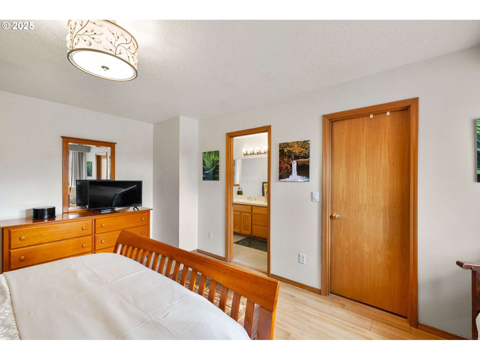 1021 Southwest 24th Street Troutdale, OR 97060 - Photo 17 of 34 a bedroom with a bed and a flat screen tv