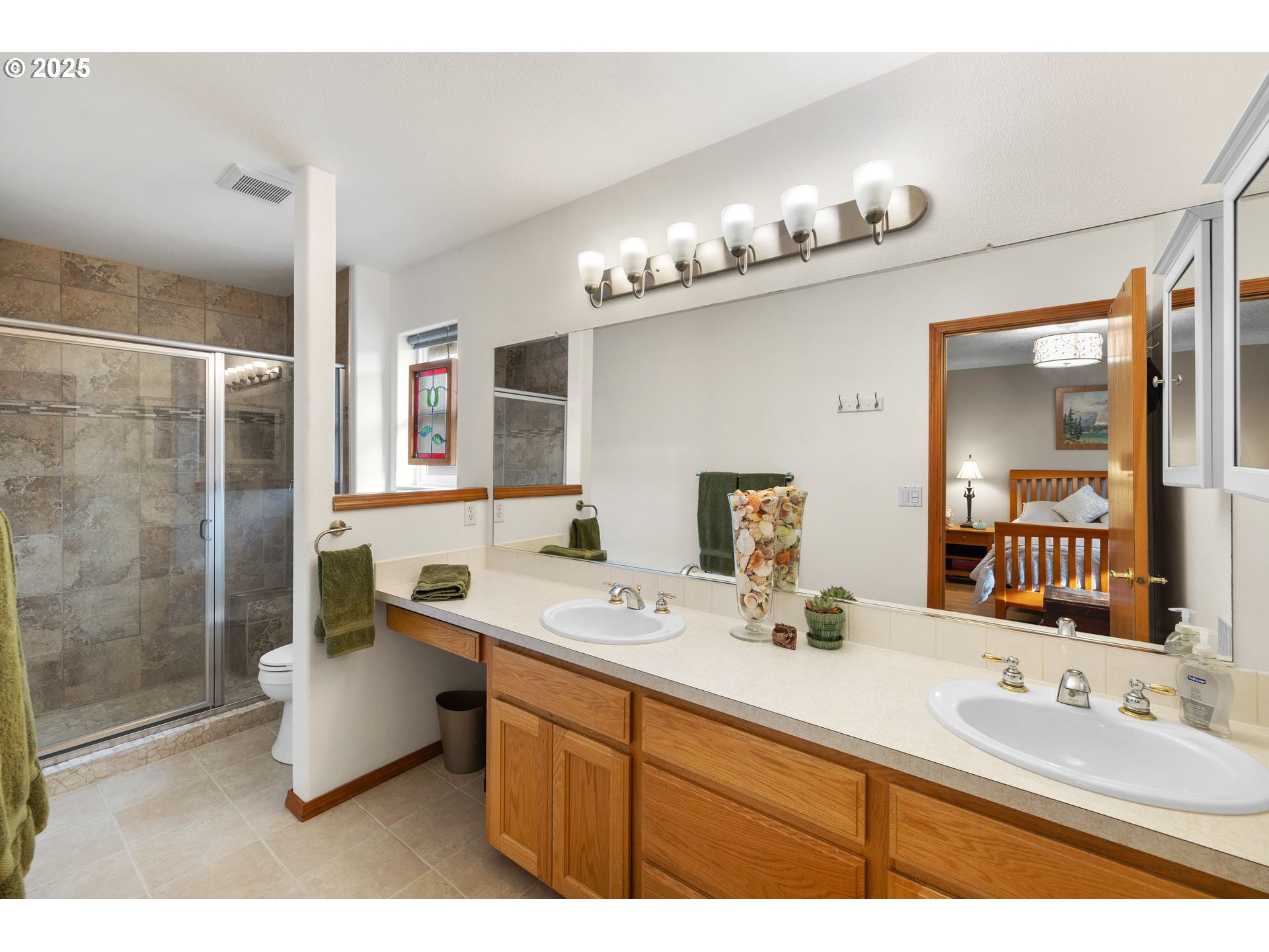 1021 Southwest 24th Street Troutdale, OR 97060 - Photo 18 of 34 a bathroom with a double vanity sink mirror and shower