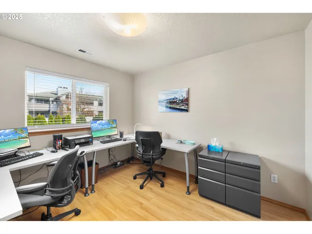 a workspace with furniture and a window