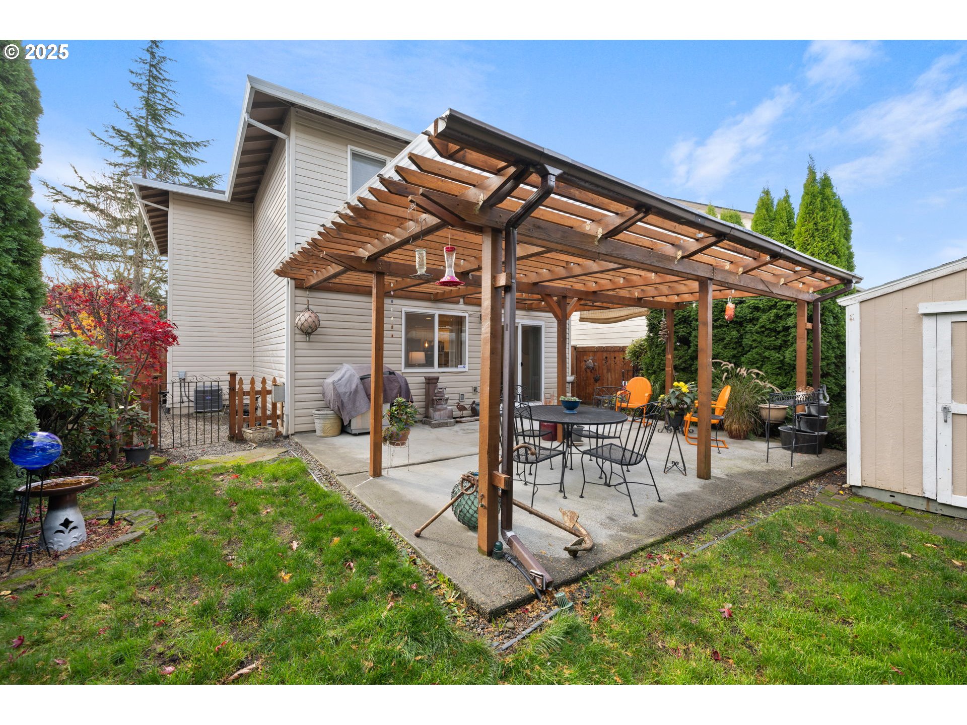 1021 Southwest 24th Street Troutdale, OR 97060 - Photo 25 of 34 a view of a patio with table and chairs and potted plants