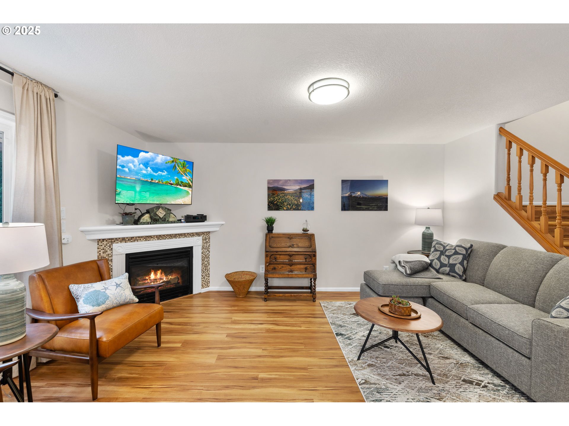 1021 Southwest 24th Street Troutdale, OR 97060 - Photo 3 of 34 a living room with furniture and a fireplace