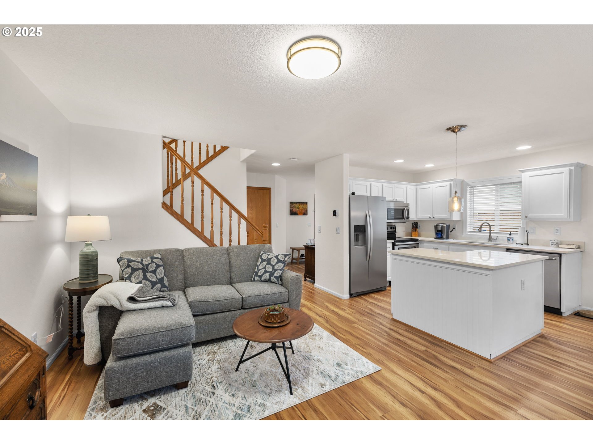 1021 Southwest 24th Street Troutdale, OR 97060 - Photo 8 of 34 a living room with furniture and kitchen view