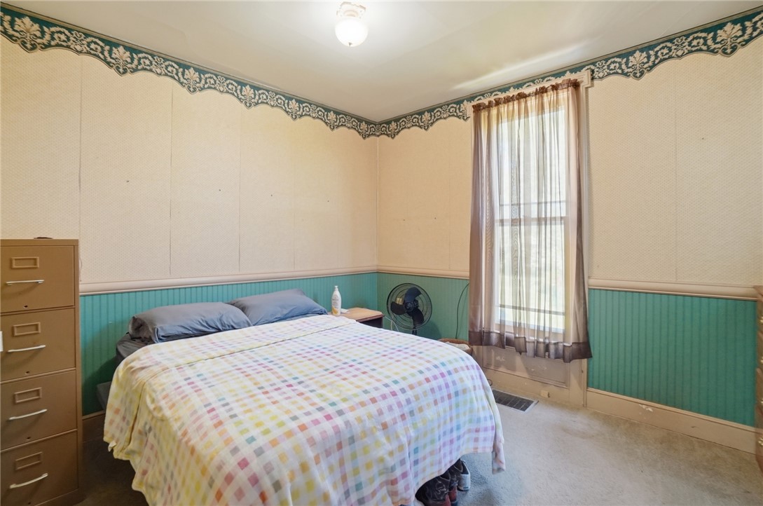 1444 Eagle City Road Springfield, OH 45504 - Photo 17 of 50 This cozy bedroom offers a tranquil retreat with ample natural light.