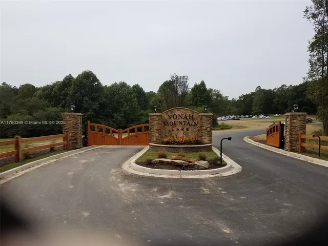 a view of a swimming pool with a yard