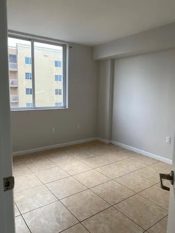 a view of an empty room with a window