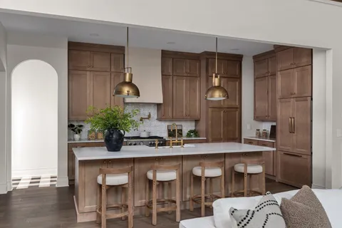 a kitchen with a table and chairs in it