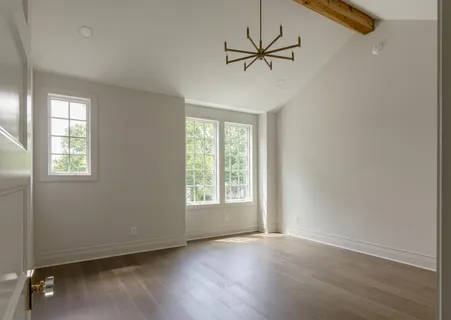 a bathroom with a double vanity sink toilet and shower