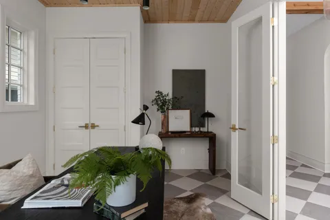 a living room with furniture and a potted plant