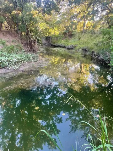 a view of lake with green space