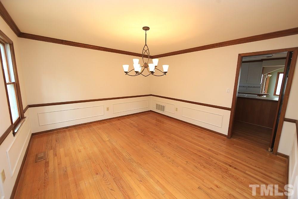 10104 East Roadstead Way Raleigh, NC 27613 - Photo 5 of 30 Hardwood floors and wainscoting