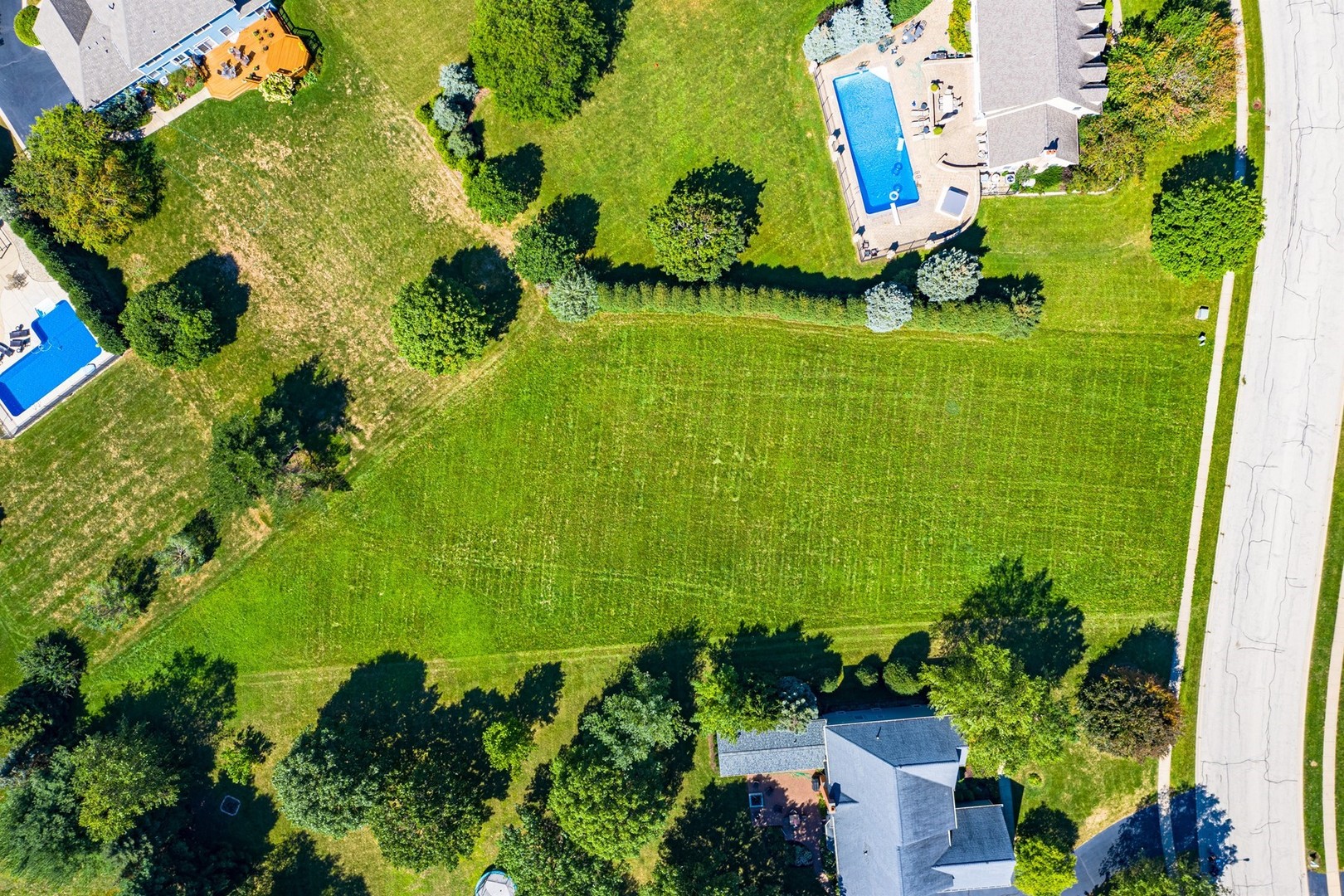 1211 Mink Trail Cary, IL 60013 - Photo 3 of 7 an aerial view of a residential houses with outdoor space and trees all around