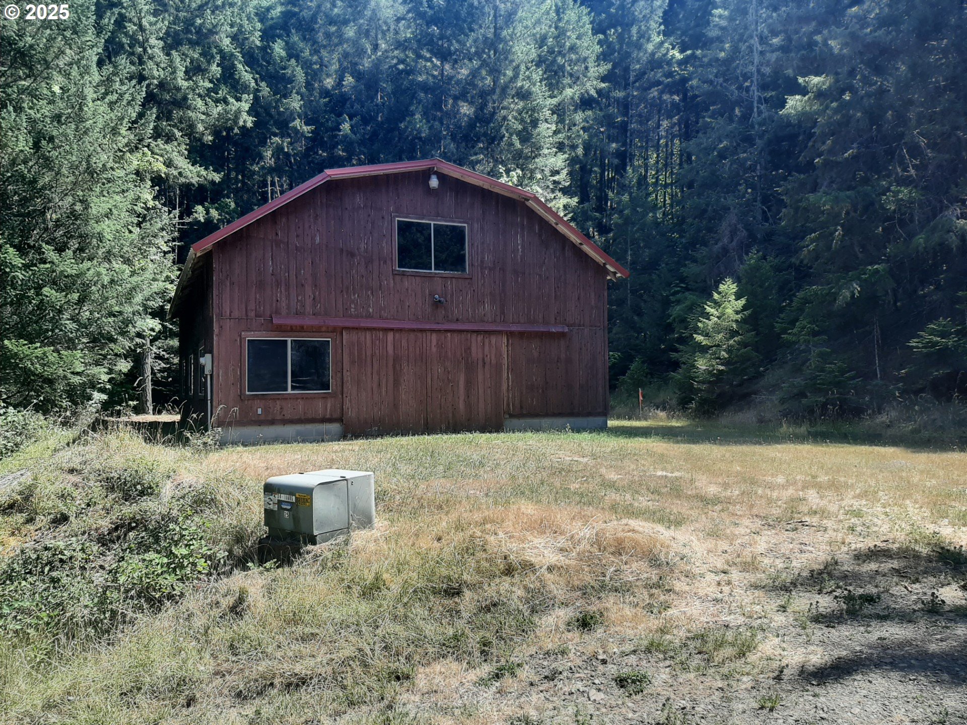 May Creek Road Days Creek, OR 97429 - Photo 12 of 44 a backyard of a house with table and chairs