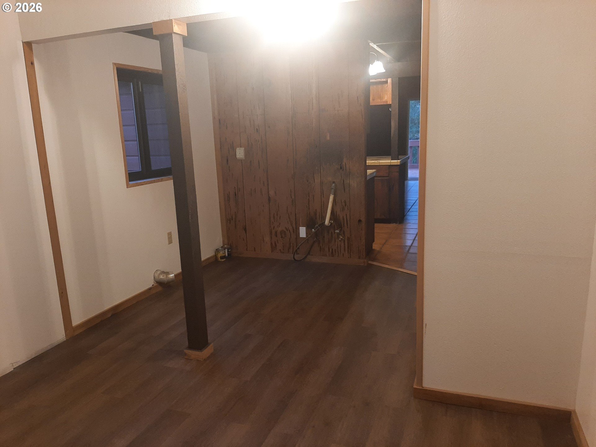 May Creek Road Days Creek, OR 97429 - Photo 29 of 44 an empty room with wooden floor and sliding door