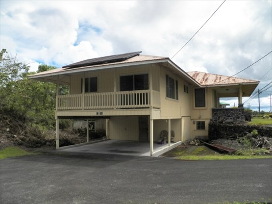 17-326 Volcano Road Kurtistown, HI 96749 - Photo 3 of 18 a front view of a house with a yard and garage