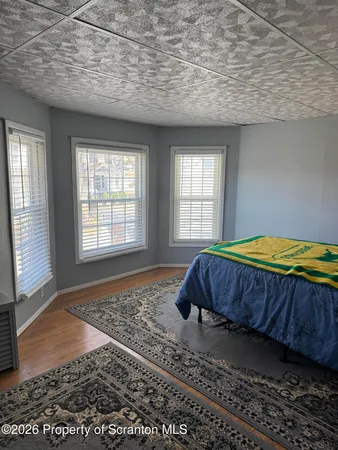 a bathroom with a toilet a sink and a window