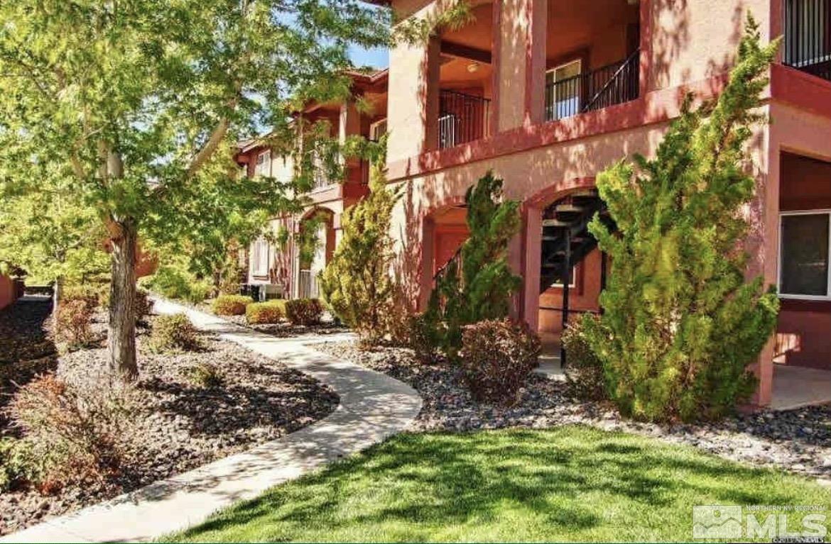 6850 Sharlands Avenue, Unit N2081 Reno, NV 89523 - Photo 1 of 27 a backyard of a building with trees