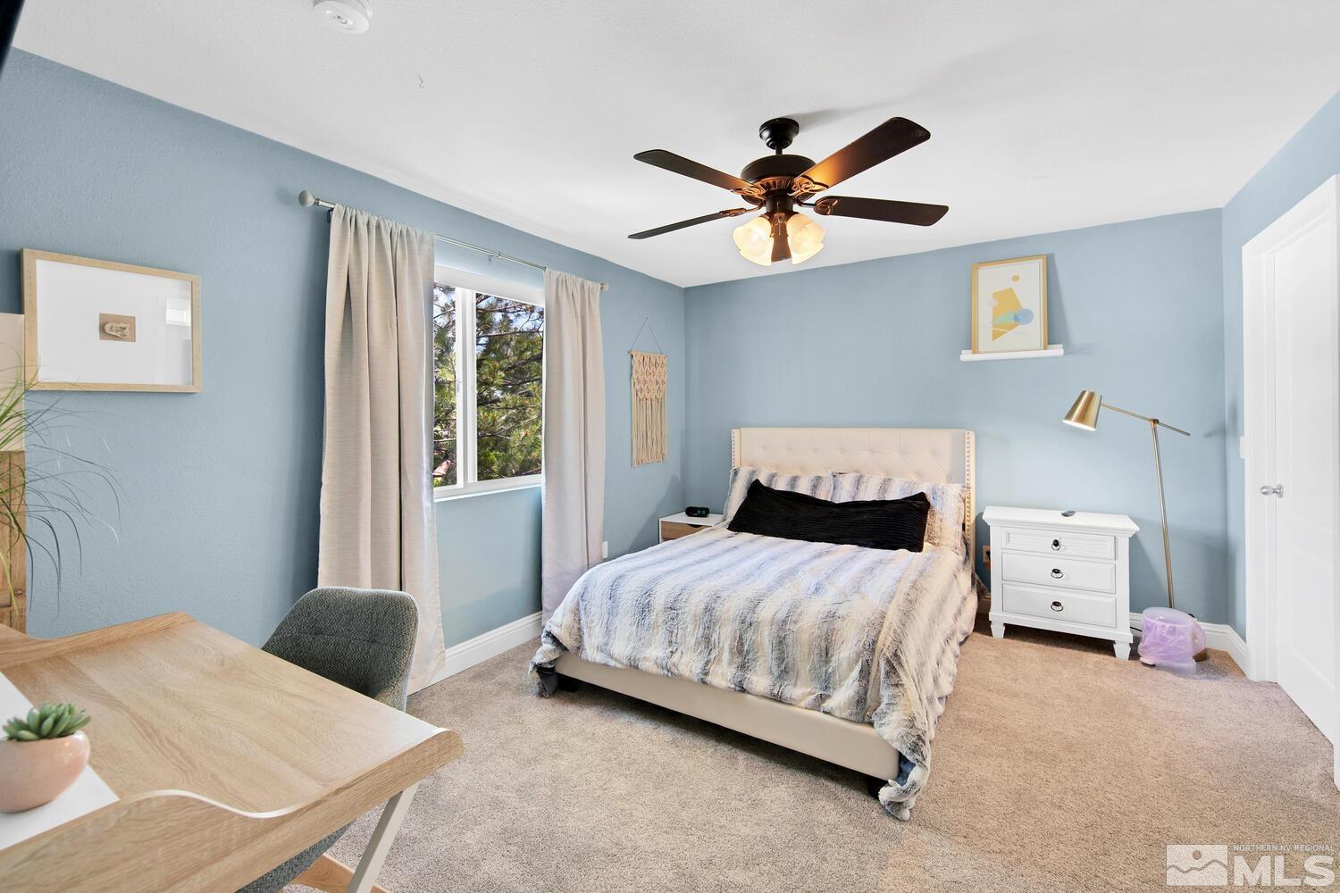 6850 Sharlands Avenue, Unit N2081 Reno, NV 89523 - Photo 13 of 27 a bedroom with a bed and window