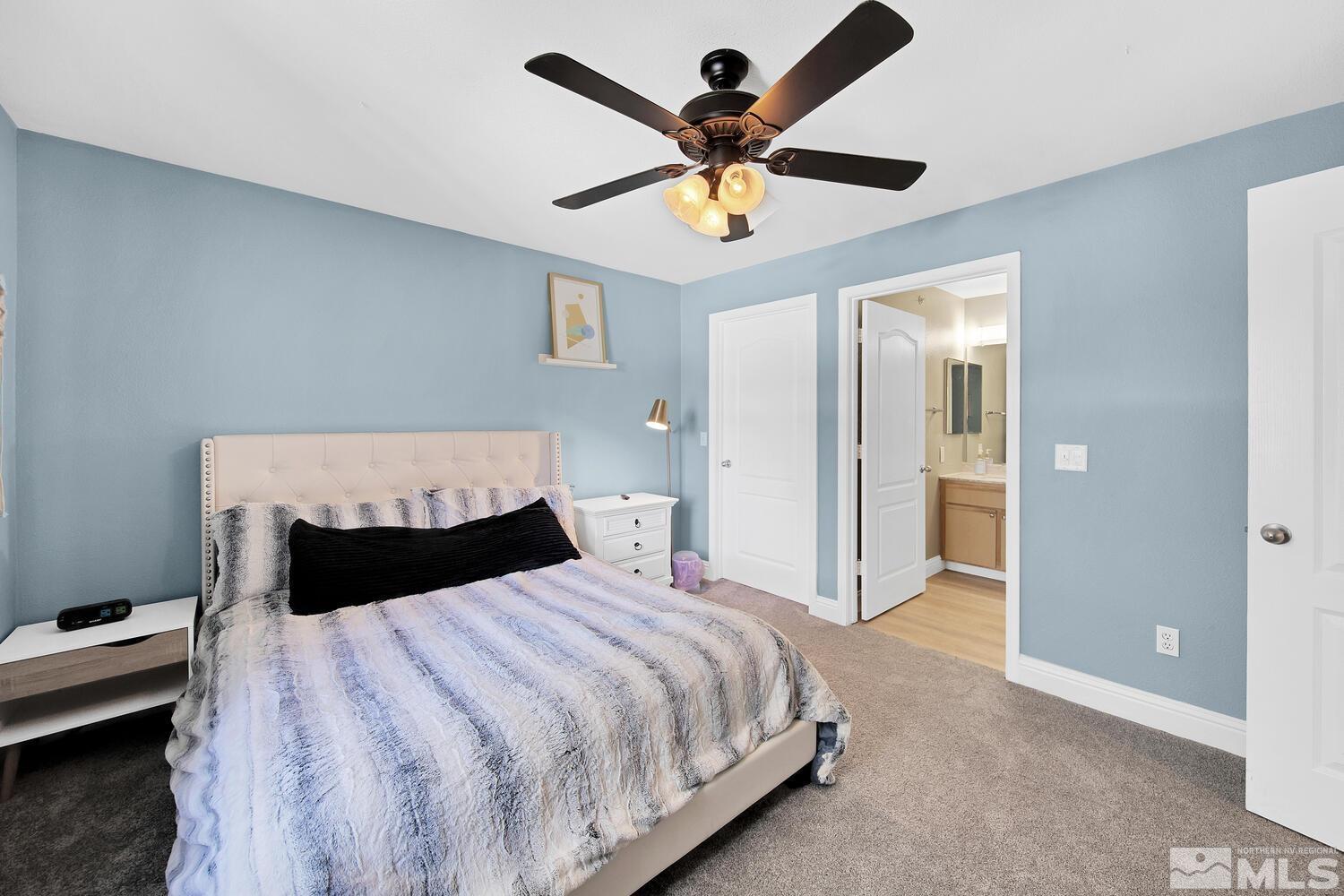 6850 Sharlands Avenue, Unit N2081 Reno, NV 89523 - Photo 14 of 27 a bedroom with a bed and a ceiling fan