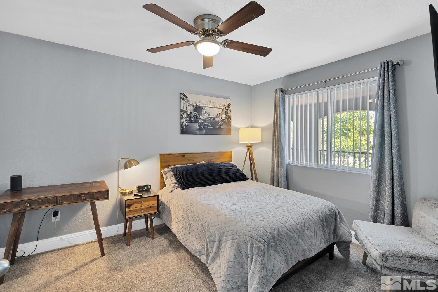 6850 Sharlands Avenue, Unit N2081 Reno, NV 89523 - Photo 19 of 27 a bedroom with a bed and a window