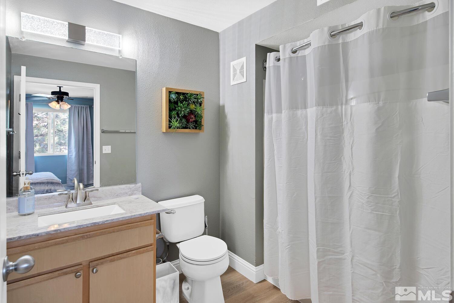 6850 Sharlands Avenue, Unit N2081 Reno, NV 89523 - Photo 20 of 27 a bathroom with a sink toilet and shower