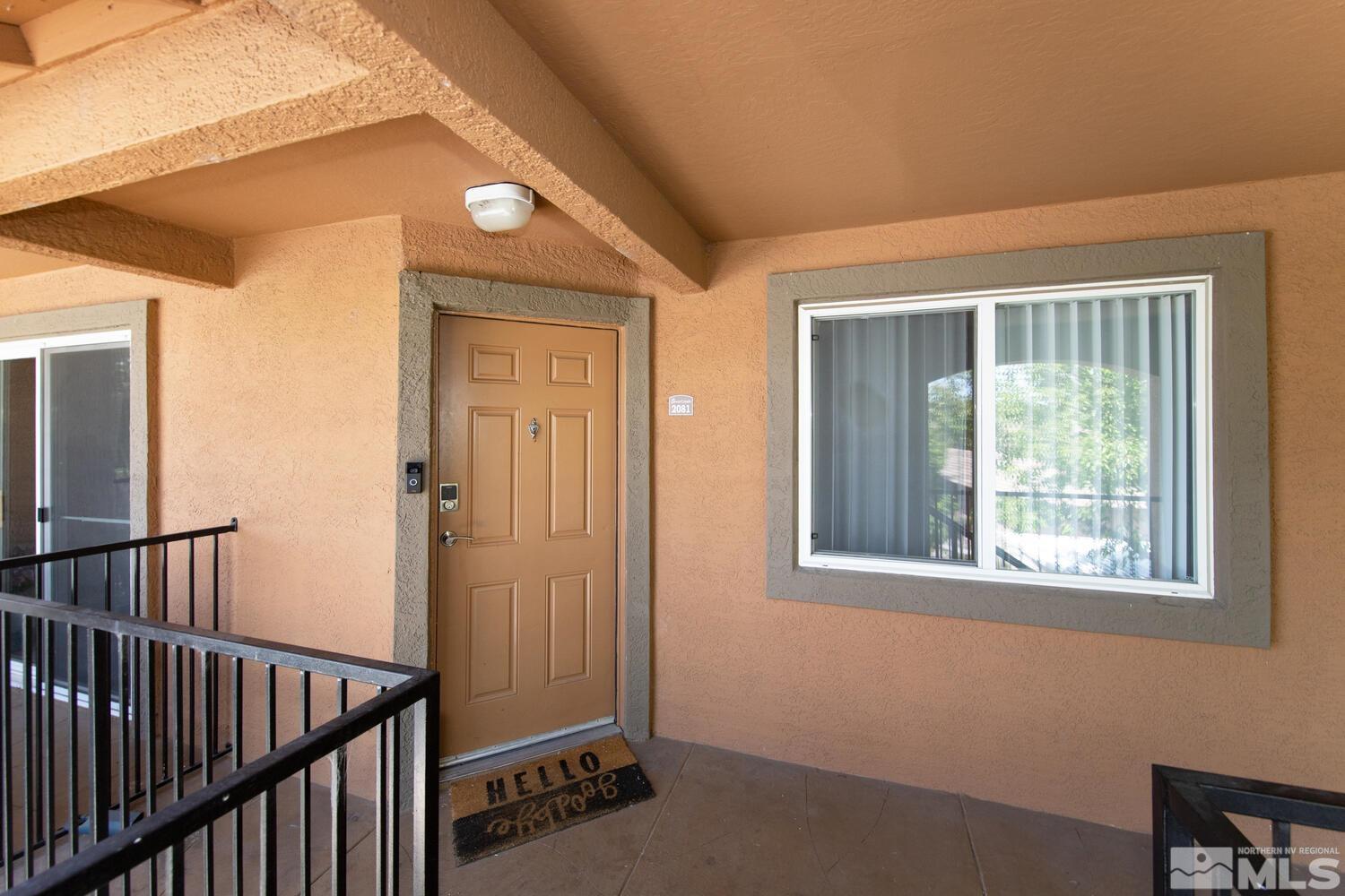 6850 Sharlands Avenue, Unit N2081 Reno, NV 89523 - Photo 2 of 27 a view of a hallway with a window