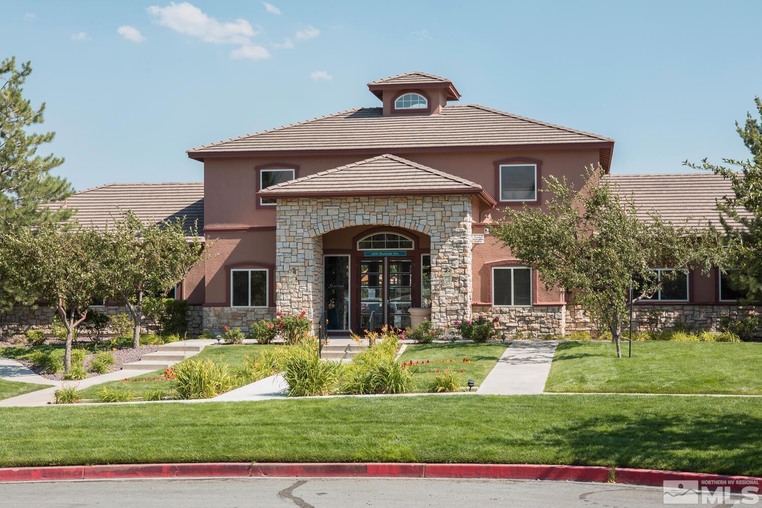 6850 Sharlands Avenue, Unit N2081 Reno, NV 89523 - Photo 23 of 27 a front view of a house with a yard