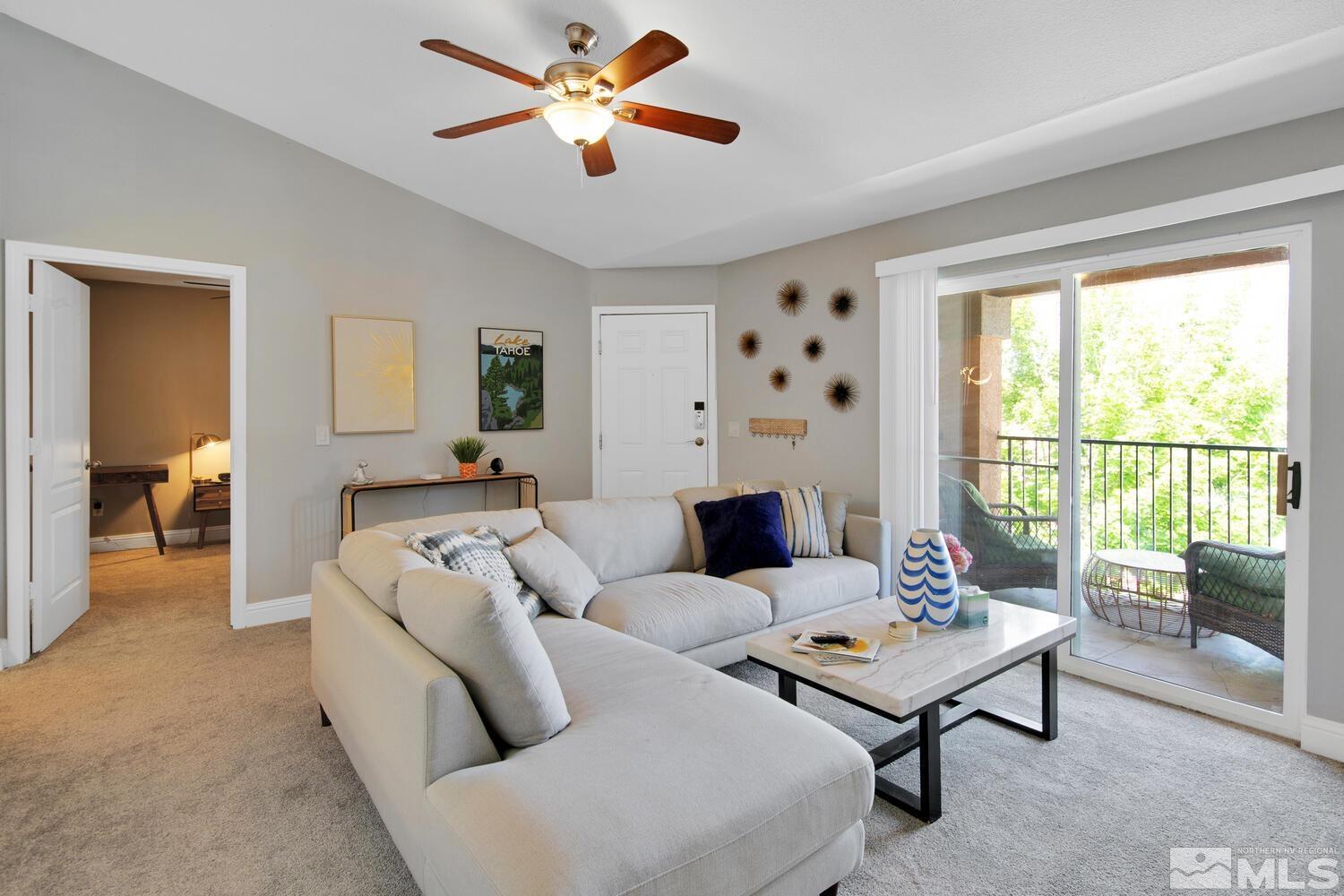 6850 Sharlands Avenue, Unit N2081 Reno, NV 89523 - Photo 5 of 27 a living room with furniture and a large window