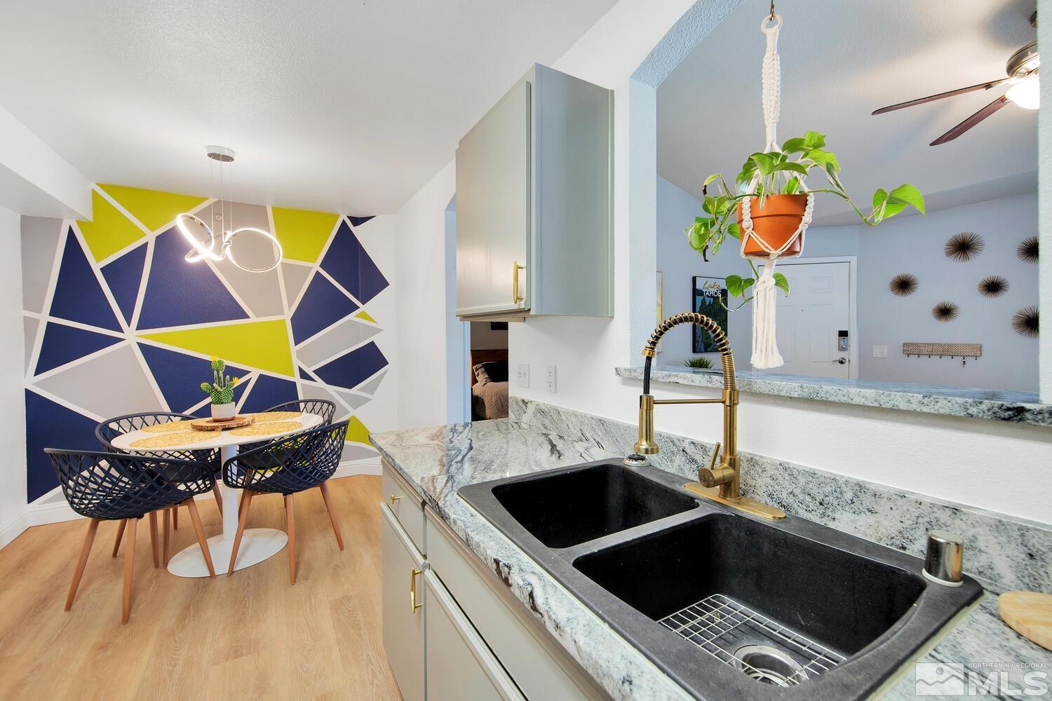 6850 Sharlands Avenue, Unit N2081 Reno, NV 89523 - Photo 10 of 27 a kitchen with a sink and a stove