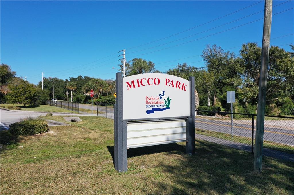 0 Oak Trail Micco, FL 32976 - Photo 12 of 20 a sign on the side of the road