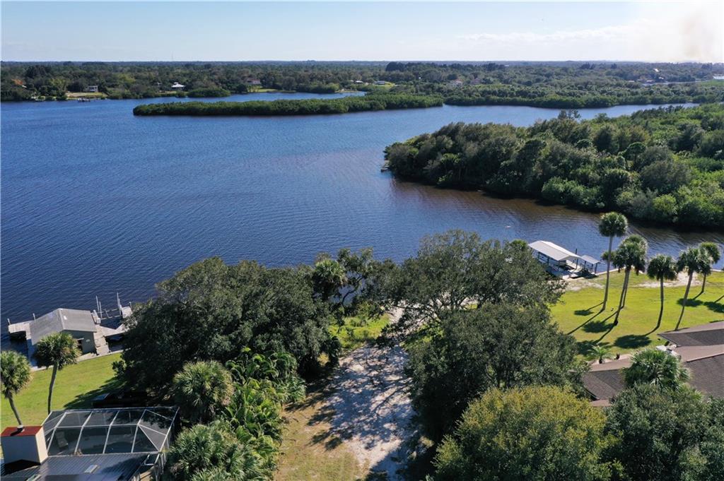 0 Oak Trail Micco, FL 32976 - Photo 8 of 20 an aerial view of residential house with outdoor space and lake view