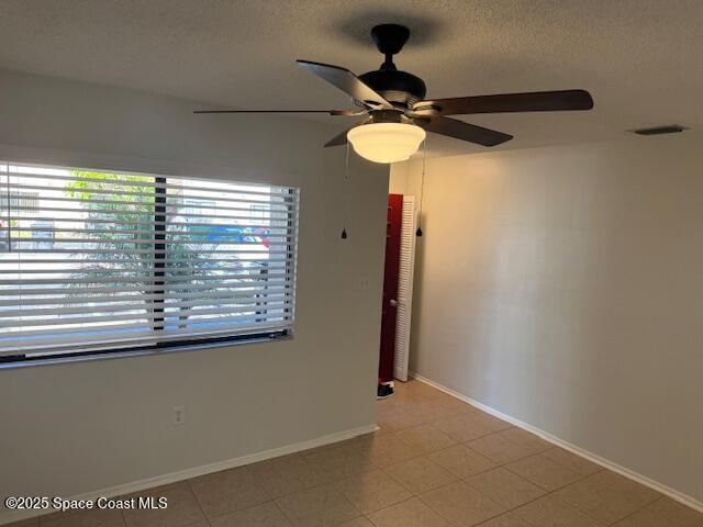 4721 Sisson Road Titusville, FL 32780 - Photo 2 of 29 a view of a room with a chandelier fan and a window