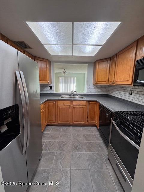 4721 Sisson Road Titusville, FL 32780 - Photo 6 of 29 a large kitchen with stainless steel appliances granite countertop a stove a sink dishwasher and a refrigerator