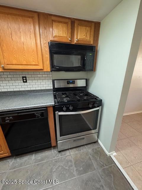 4721 Sisson Road Titusville, FL 32780 - Photo 8 of 29 a kitchen with a stove and a microwave